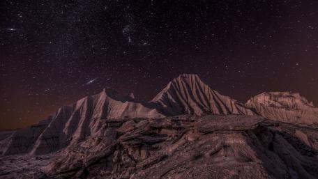 Majestic Mountains Under a Starry Night Sky wallpaper