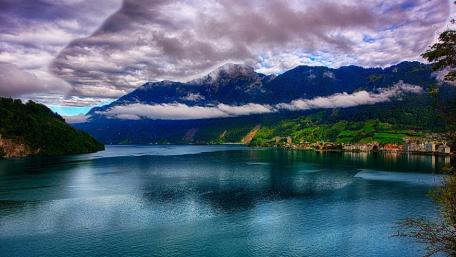 Serene Lake Under Cloudy Sky wallpaper