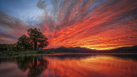 Burning Sky Over Tranquil Lake at Sunset wallpaper