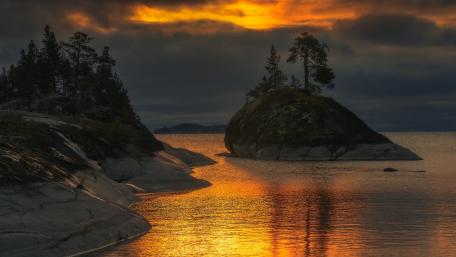 Serene Sunset Over a Tranquil Island wallpaper