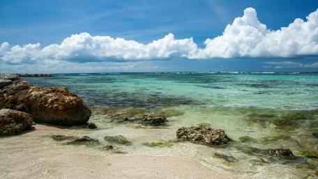 Tranquil Shoreline View Under Beautiful Clouds wallpaper