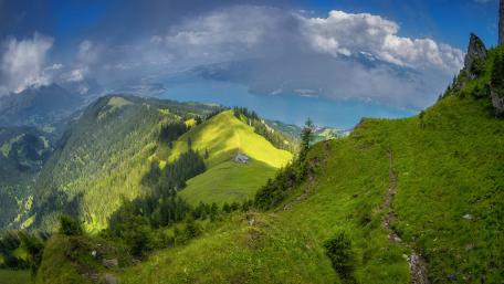 Majestic Alpine Landscape Overlooking a Serene Lake wallpaper