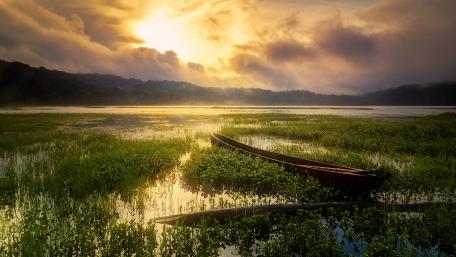 Serene Boat on Tranquil Lake Scene wallpaper