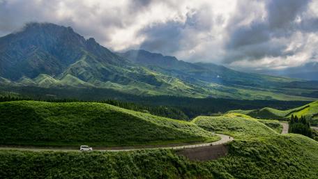 Majestic Mountain Landscape Under Stormy Skies wallpaper