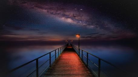 Pier on a starry night wallpaper