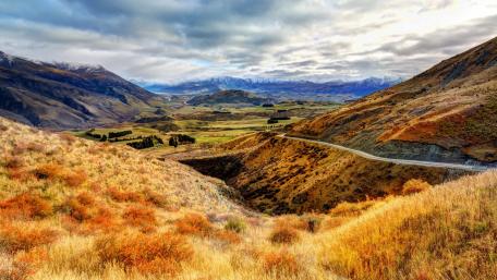 Serene Valley Landscape in Vibrant Autumn Colors wallpaper