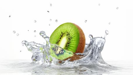 Refreshing Kiwi Splashing in Water wallpaper