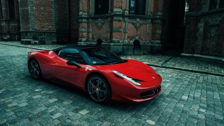 Stunning Red Ferrari on Cobblestone Drive wallpaper