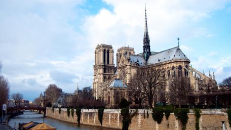 Majestic Notre Dame Cathedral by the Seine River wallpaper