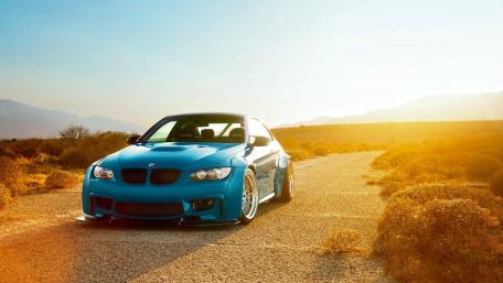 Sleek BMW M3 on a Desert Road wallpaper