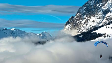 Soaring Above Snowy Mountains and Clouds wallpaper