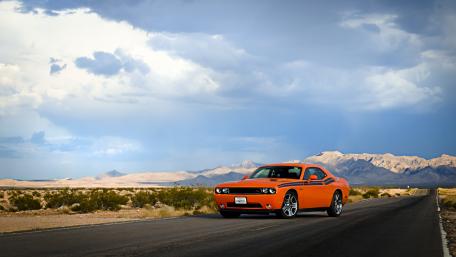 Bold Dodge Challenger Performance on an Open Road wallpaper