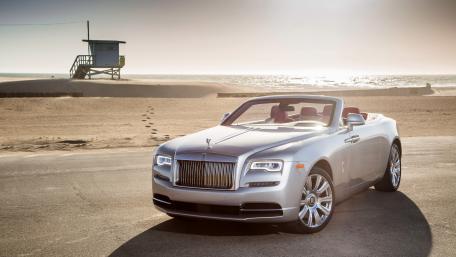 Luxury Rolls-Royce Dawn at Serene Beach Scene wallpaper