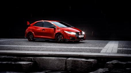Sleek Red Honda Civic in Urban Setting wallpaper