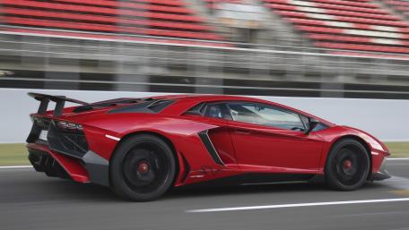 Sleek Red Lamborghini Aventador SV in Motion wallpaper