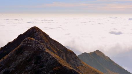 Majestic Peaks Above the Clouds wallpaper
