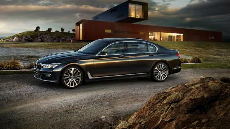 Sleek Black BMW by Modern Architecture wallpaper