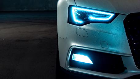 Sleek Car Headlamp Glow wallpaper