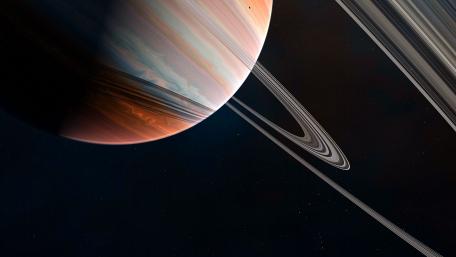 A Majestic Ringed Planet in Space wallpaper