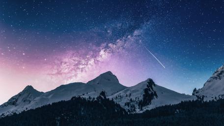 Starry Winter Night over Snowy Peaks wallpaper