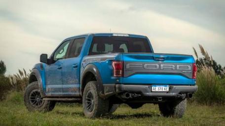 Bold Blue Ford Raptor Ready for Adventure wallpaper