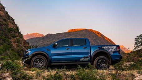 Bold Ford Raptor Against Stunning Mountain Landscape wallpaper