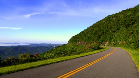 Winding Road through Mountain Scenery wallpaper