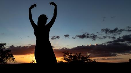Graceful Maiden Dancing at Sunset wallpaper
