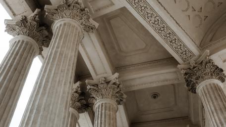 Majestic Architectural Columns in Urban Setting wallpaper