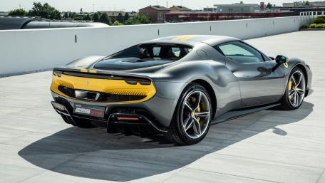 Sleek Ferrari 296 GTB in Stunning Setting wallpaper