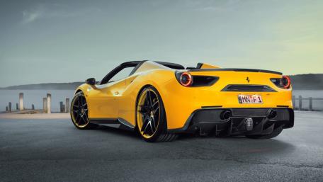 Vibrant Yellow Ferrari 488 Spider in Scenic Setting wallpaper