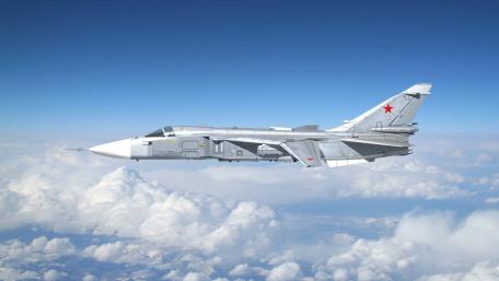Sukhoi Su-24 in Flight Above the Clouds wallpaper