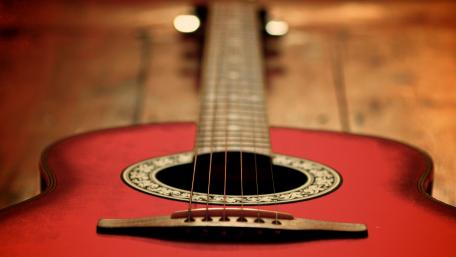 Vibrant Acoustic Guitar Close-Up Wallpaper wallpaper
