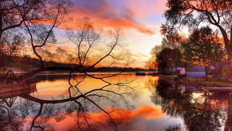 Autumn Reflections at Dusk Over a Tranquil Lake wallpaper