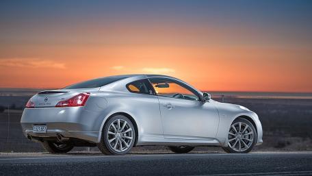 Sleek Nissan Coupe Against a Stunning Sunset View wallpaper