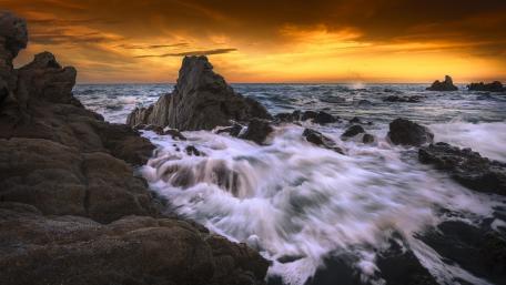 Stunning Sunset Over Rocky Seascape wallpaper