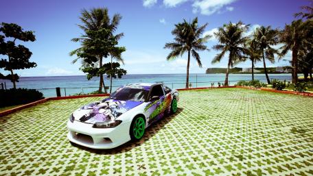 Vibrant Car by the Ocean Shore wallpaper
