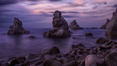 Mystical Purple Skies Over Serene Waters wallpaper