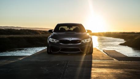 Sleek BMW Under a Golden Sunset wallpaper
