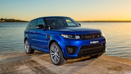 Sleek Blue Range Rover by the Waterfront wallpaper