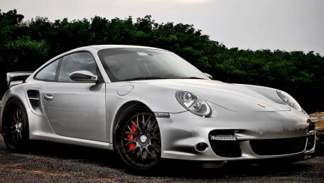Sleek Silver Porsche 997 Ready to Roar wallpaper