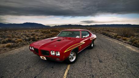 Classic Pontiac Muscle Car on Open Road wallpaper