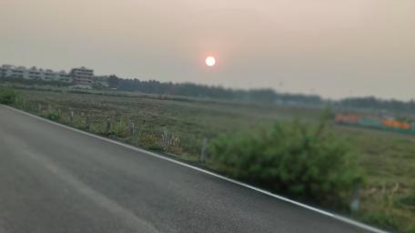 Serene Sunset Over Rolling Fields wallpaper
