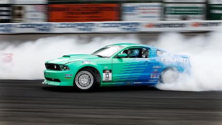 Thrilling Drift Action with Smoke Clouds wallpaper