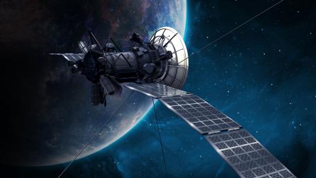 Satellite Orbiting Earth in Deep Space wallpaper