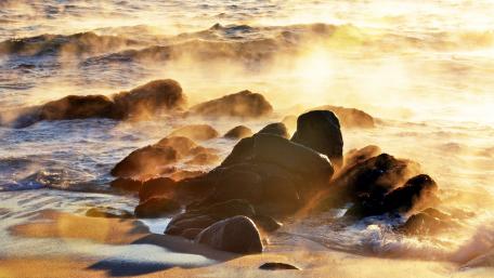Golden Light on Serene Coastal Rocks wallpaper