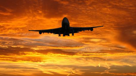 Airplane in Glorious Sunset Skies wallpaper
