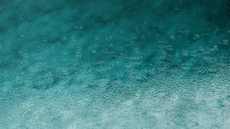 Raindrop Symphony on a Blue Canvas wallpaper