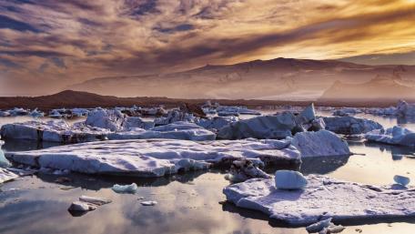 Majestic Icebergs under a Colorful Sky wallpaper