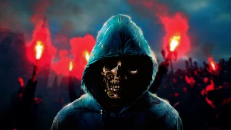 Mystical Hooded Skull Amidst Fiery Chaos wallpaper